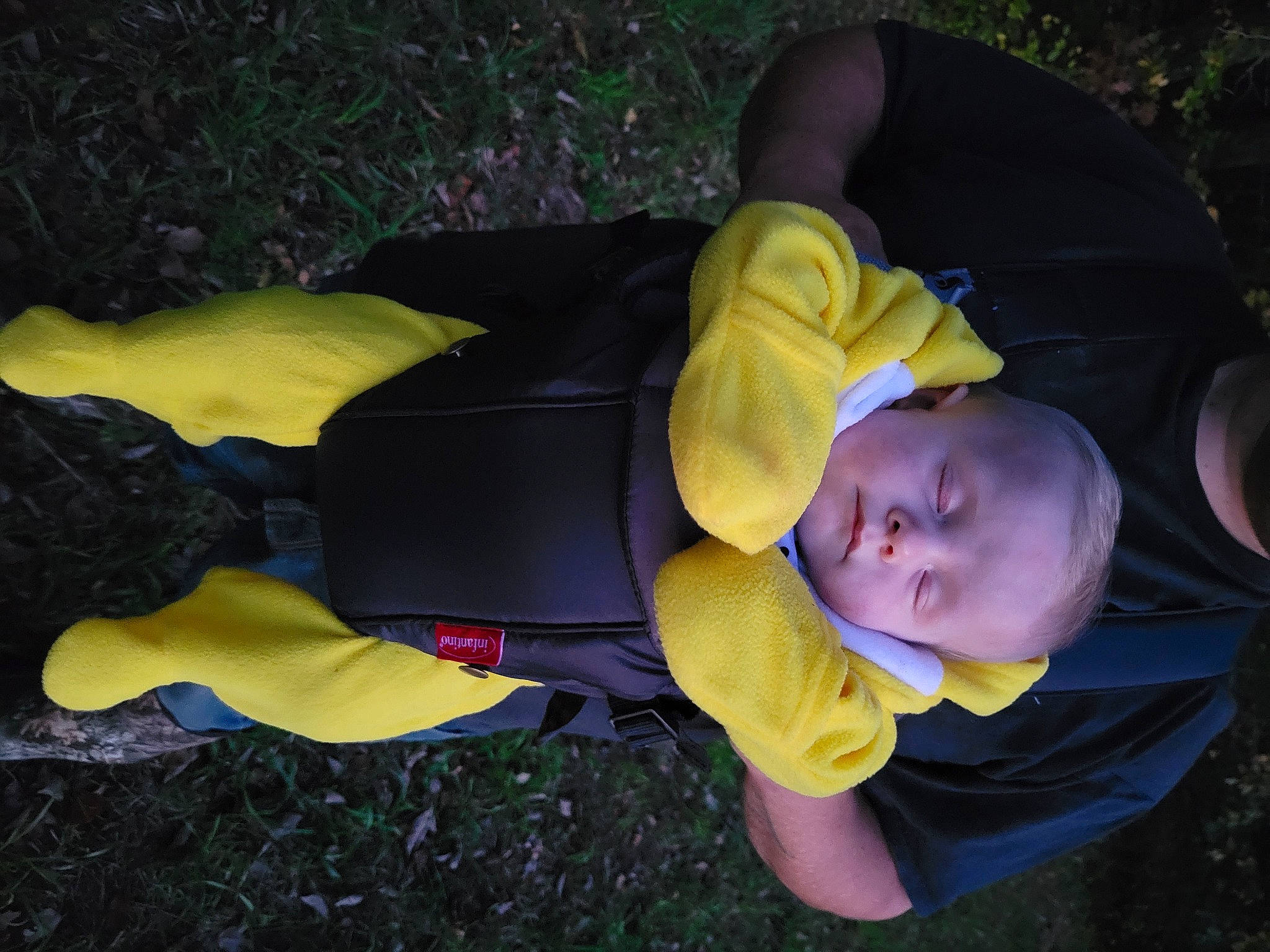 Logan is registered to the contest to win money with this photo: baby, baby_products, baby_safety, baby_toddler_clothing, child, comfort, fun, grass, hat, lawn, person, personal_protective_equipment, plant, sitting, toddler, tree