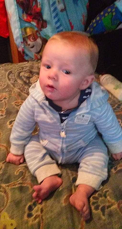 Logan joined the competition — help win amazing prizes! baby, baby_toddler_clothing, beauty, blue, cheek, child, comfort, eye, facial_expression, finger, floor, flooring, fun, grass, nose, person, sitting, skin, sleeve, toddler