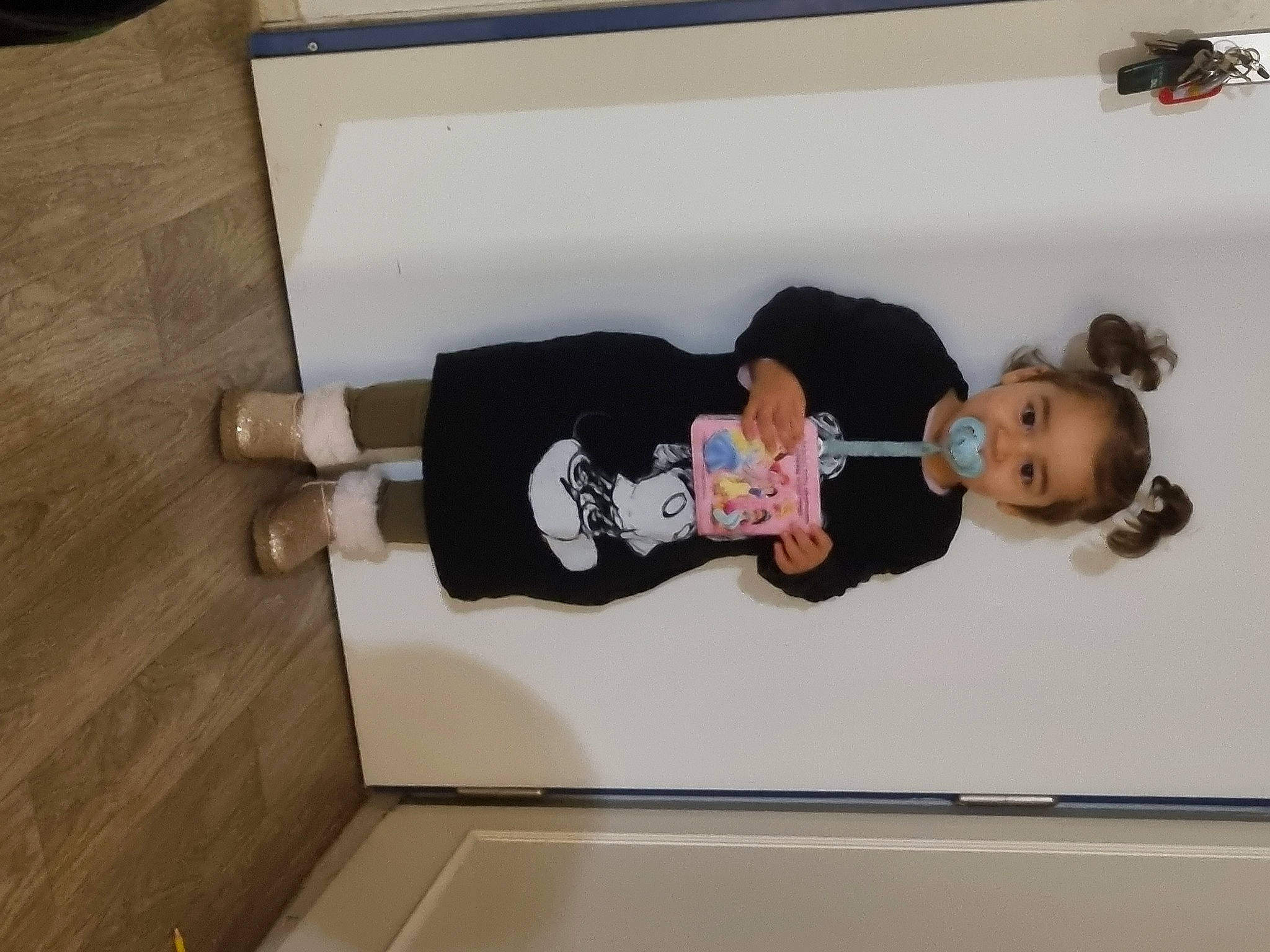 Sarah participe au concours pour gagner de l'argent avec cette photo : baby, baby_toddler_clothing, child, flooring, fun, hardwood, person, room, sock, toddler, wood