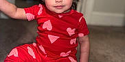 Elena joined the competition — help win amazing prizes! toddler, child, pajamas, red_clothing, hearts_pattern, sitting, floor, wooden_floor, carpet, indoors, portrait, face, hair, pigtails, cute, young_child, eyes, smile, hand, person