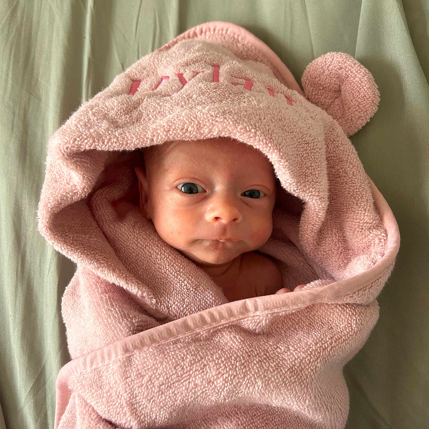 Dylan joined the competition — help win amazing prizes! baby, blanket, bonnet, clothing, face, happy, hat, head, hood, newborn, person, photography, portrait, quilt, smile, towel