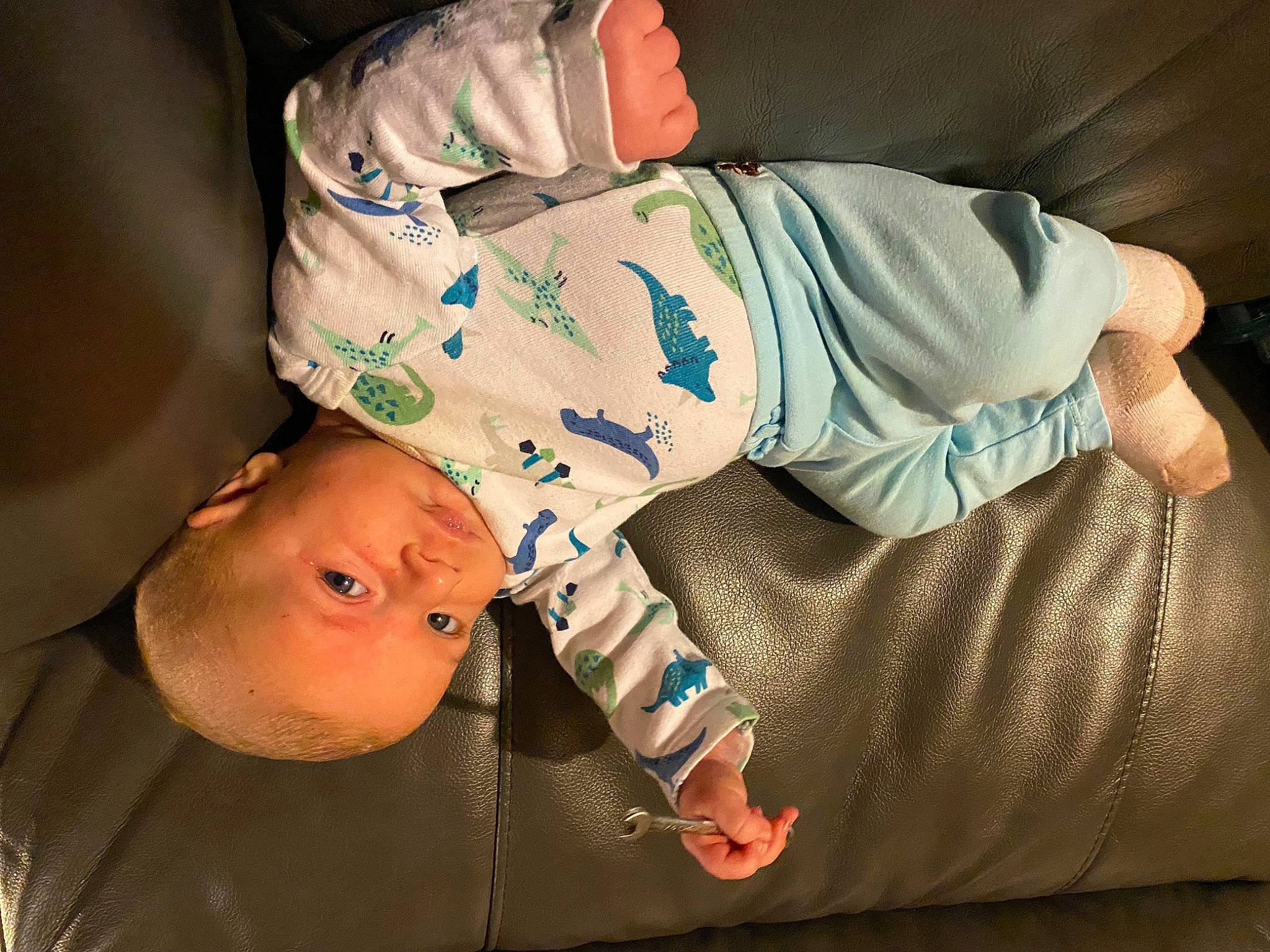 Scott Kopas is registered to the contest to win money with this photo: baby, baby_products, baby_sleeping, baby_toddler_clothing, cheek, child, comfort, elbow, eye, glasses, hand, happy, infant_bodysuit, mouth, pattern, person, sitting, skin, sleeve, t_shirt