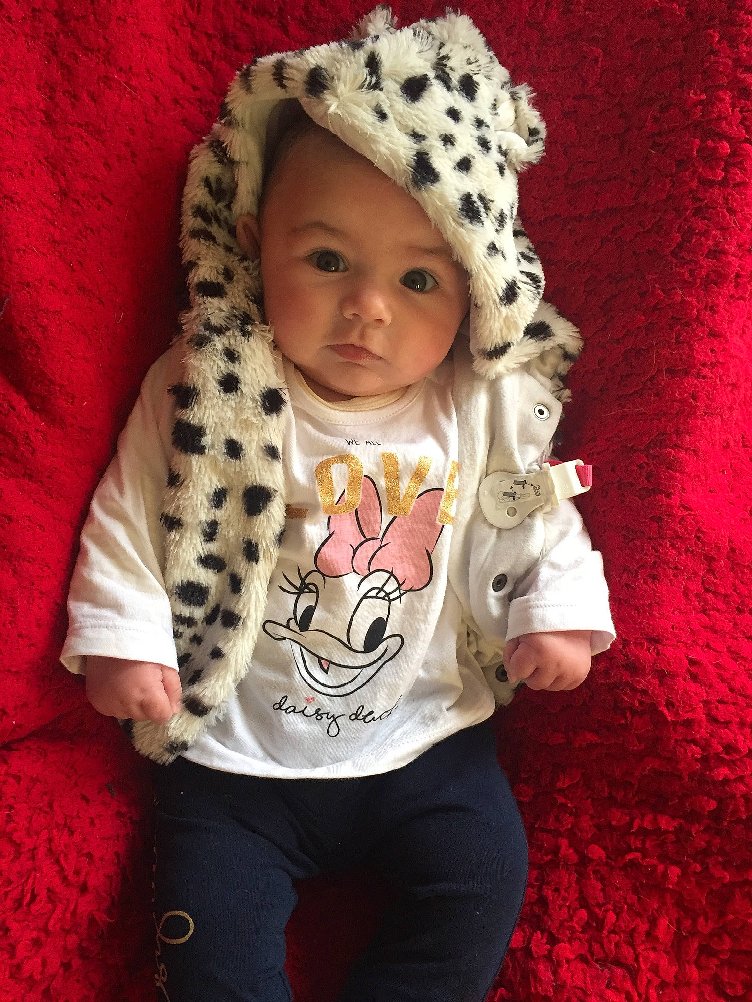 Louise participe au concours pour gagner de l'argent avec cette photo : baby, baby_toddler_clothing, cap, cheek, child, eye, face, happy, head, headgear, headwear, human_body, lip, magenta, outerwear, pattern, person, pink, skin, sleeve