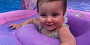 Emberlynn joined the competition — help win amazing prizes! baby, child, pool, water, inflatable, float, purple, smiling, swimming, outdoor, summer, playful, canopy, mermaid_pattern, fence, backyard, wet_hair, sleeveless, fun, young