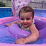 baby, child, pool, water, inflatable, float, purple, smiling, swimming, outdoor, summer, playful, canopy, mermaid_pattern, fence, backyard, wet_hair, sleeveless, fun, young