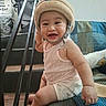 Zyron joined the competition — help win amazing prizes! baby, child, smiling, happy, portrait, sitting, sofa, couch, hat, sun_hat, chin_strap, pink_outfit, diaper, indoor, living_room, staircase, cushion, home, candid, photography