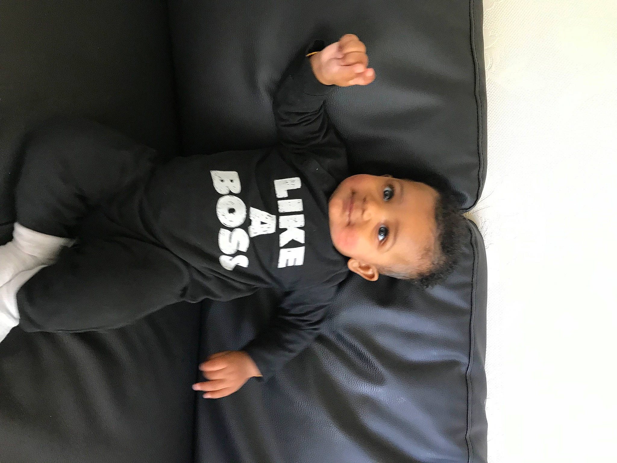 Miles joined the competition — help win amazing prizes! baby_toddler_clothing, black_hair, child, comfort, elbow, flash_photography, font, formal_wear, fun, gesture, happy, hat, joy, knee, person, room, sitting, sleeve, smile, sportswear