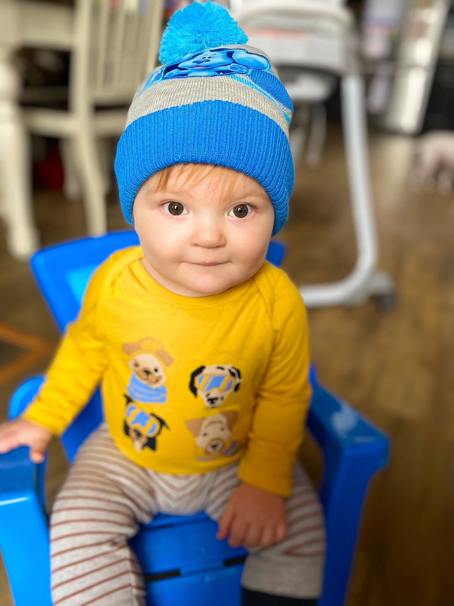 Greyson is registered to the contest to win money with this photo: azure, baby, baby_playing_with_toys, baby_toddler_clothing, blue, cap, child, electric_blue, fashion_accessory, flooring, fun, happy, headgear, headwear, knit_cap, person, recreation, riding_toy, smile, toddler