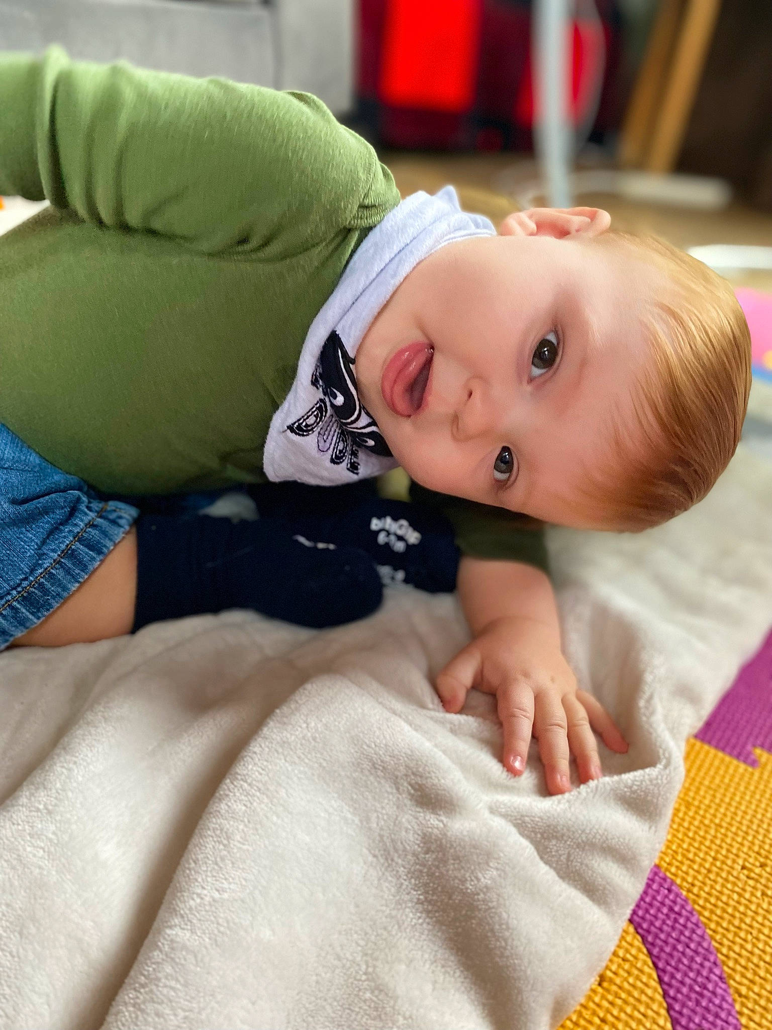 Greyson joined the competition — help win amazing prizes! baby, baby_toddler_clothing, bedding, cheek, child, comfort, finger, flooring, fur, human_body, linens, mammal, outerwear, person, sitting, skin, sleeve, textile, toddler, vertebrate