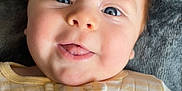 Niko is registered to the contest to win money with this photo: baby, bodypart, clothing, coat, face, happy, head, jacket, knitwear, laughing, mouth, newborn, person, photography, portrait, selfie, shirt, smile, sweater, teeth