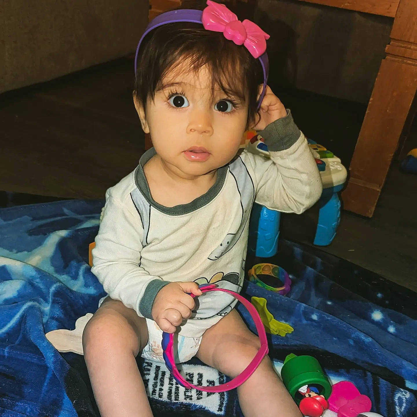 Marco is registered to the contest to win money with this photo: baby_toddler_clothing, bangs, cheek, child, eye, eyelash, fun, hair, happy, head, human_body, iris, lip, nose, person, pink, skin, sleeve, snapshot, thigh