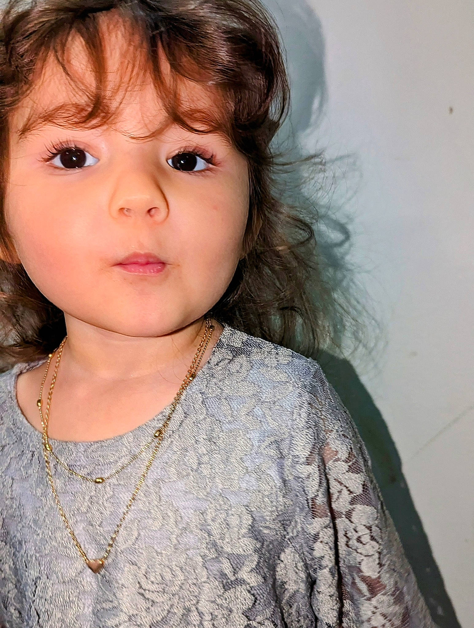 Serenity Luna is registered to the contest to win money with this photo: baby_toddler_clothing, bangs, brown_hair, cheek, chin, ear, embellishment, eyelash, flash_photography, happy, iris, jaw, lip, neck, no_expression, nose, person, skin, sleeve, smile