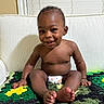 Kasai is registered to the contest to win money with this photo: baby, smiling, diaper, couch, blanket, crochet, indoors, child, happy, cute, feet, hands, person, portrait, window, blinds, skin, sitting, infant, home