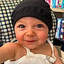 éléna a rejoint le concours — aidez-le/la à gagner de superbes lots ! baby, background, black_hat, board_games, chair, checkered_pattern, cheeks, child, closeup, cute, eyes, face, hat, indoor, infant, person, portrait, sitting, smiling, white_top