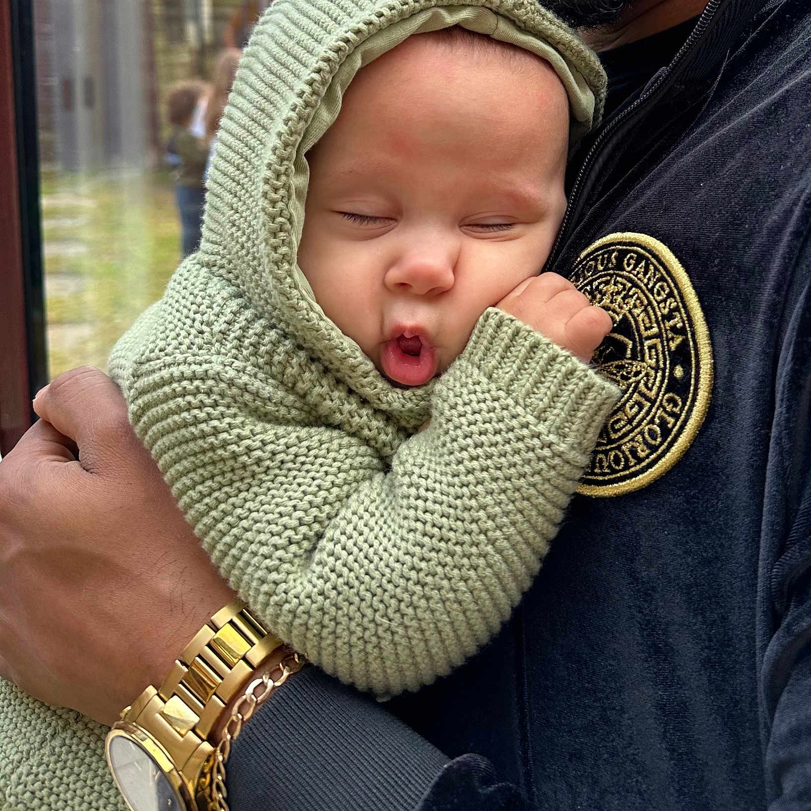 Hazel is registered to the contest to win money with this photo: baby, bonnet, clothing, coat, face, hat, head, hood, hoodie, jacket, knitwear, newborn, person, photography, portrait, scarf, sweater, sweatshirt, wristwatch, yawning
