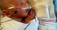 Colt joined the competition — help win amazing prizes! newborn, baby, sleeping, hospital, blanket, nasal_cannula, medical, infant, swaddled, peaceful, child, healthcare, cute, patient, resting, soft, closeup, person, tiny, portrait