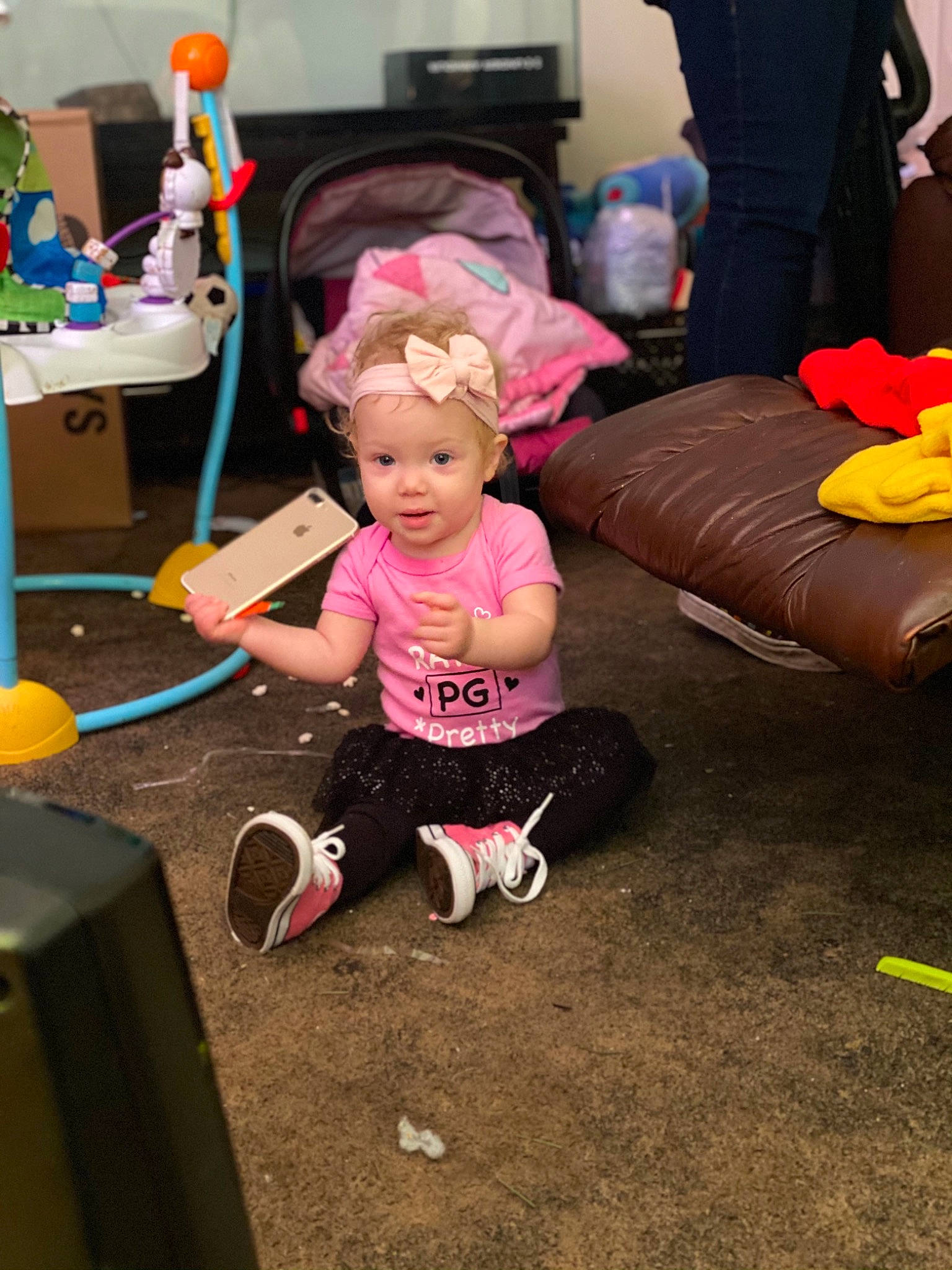Rosaleigh is registered to the contest to win money with this photo: baby, child, comfort, event, floor, flooring, fun, happy, hat, headwear, leg, leisure, magenta, person, pink, play, purple, sitting, smile, t_shirt