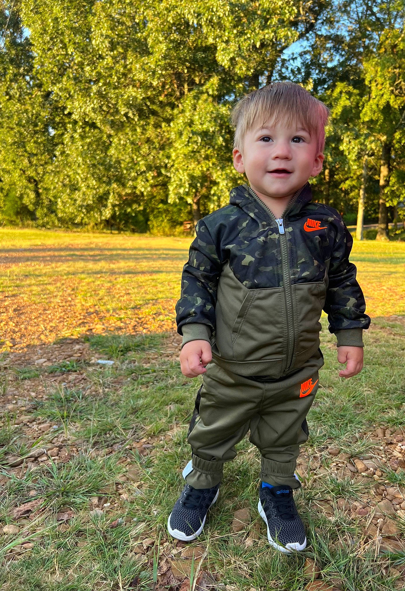 Tanner joined the competition — help win amazing prizes! baby, baby_toddler_clothing, child, eye, face, fun, garden, grass, grassland, happy, jacket, leisure, pattern, people_in_nature, person, plant, sitting, sleeve, soil, toddler