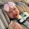 Summer joined the competition — help win amazing prizes! baby, child, smiling, car_seat, pink_bow, infant, happy, cute, seatbelt, closeup, face, hand, clothing, indoor, person, safety, transportation, newborn, headwear, toddler
