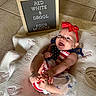 Summer joined the competition — help win amazing prizes! baby, infant, smiling, red_bow, patriotic_clothing, blanket, sign, milestone, four_months, happy, cute, indoor, floor_tiles, portrait, child, celebration, hands, feet, headband, toddler
