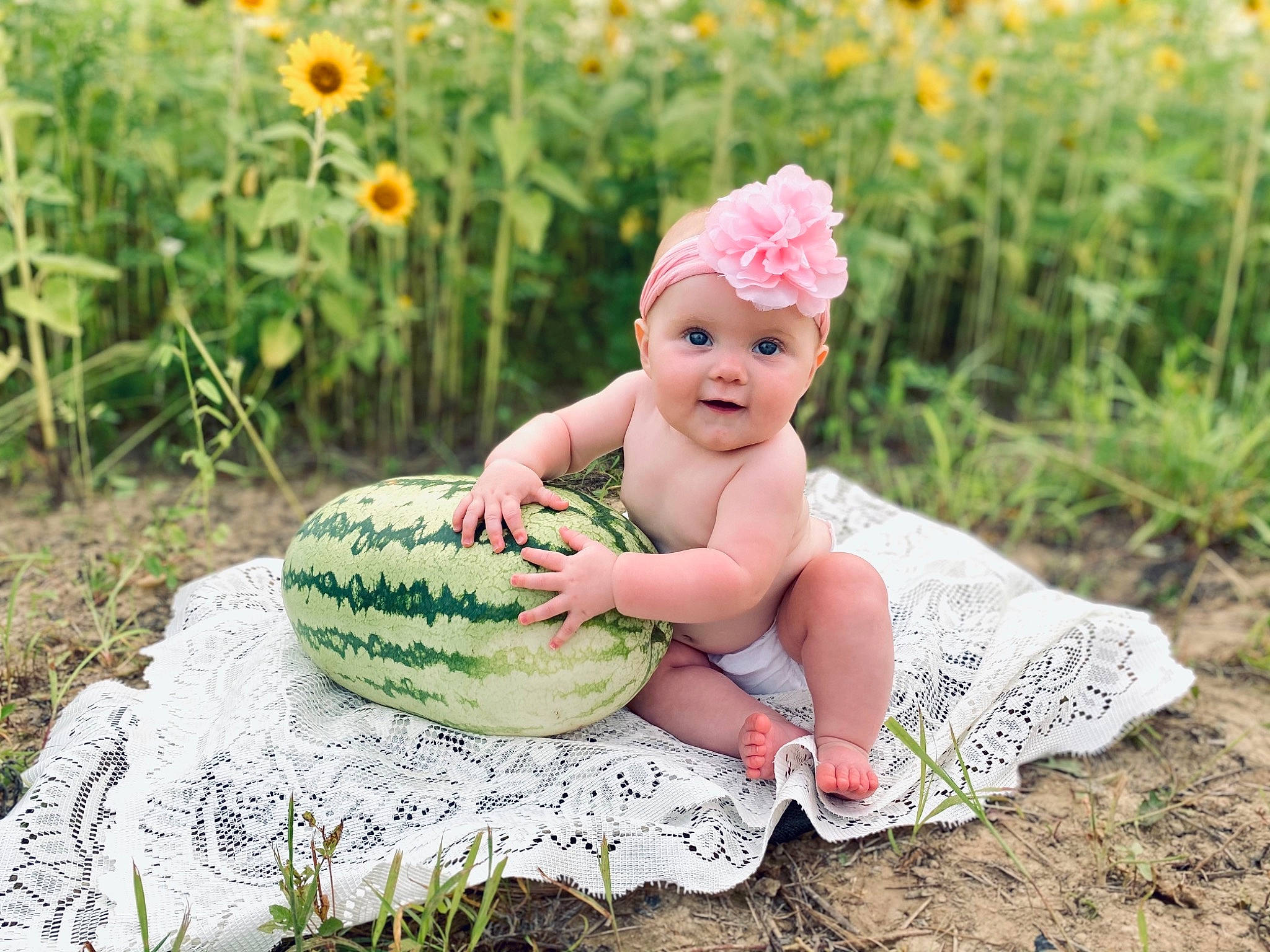 Charlotte joined the competition — help win amazing prizes! baby, baby_toddler_clothing, cap, child, fashion_accessory, flash_photography, flower, grass, grass_family, grassland, happy, headgear, headpiece, headwear, people_in_nature, person, plant, sitting, smile, summer