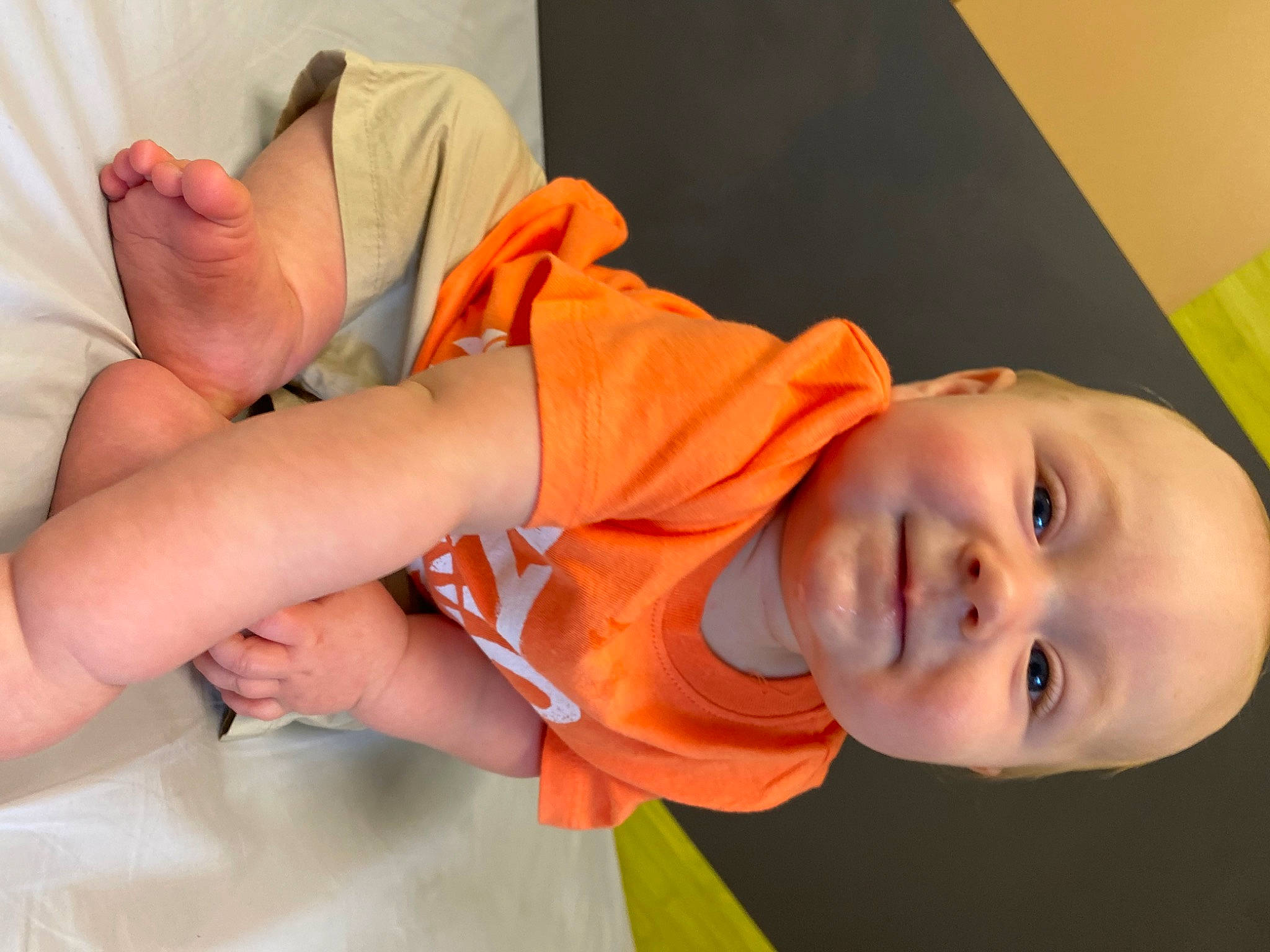 Koby joined the competition — help win amazing prizes! baby, baby_toddler_clothing, child, comfort, elbow, finger, gesture, hand, happy, human_body, human_leg, joy, knee, mammal, orange, person, skin, sleeve, smile, thumb