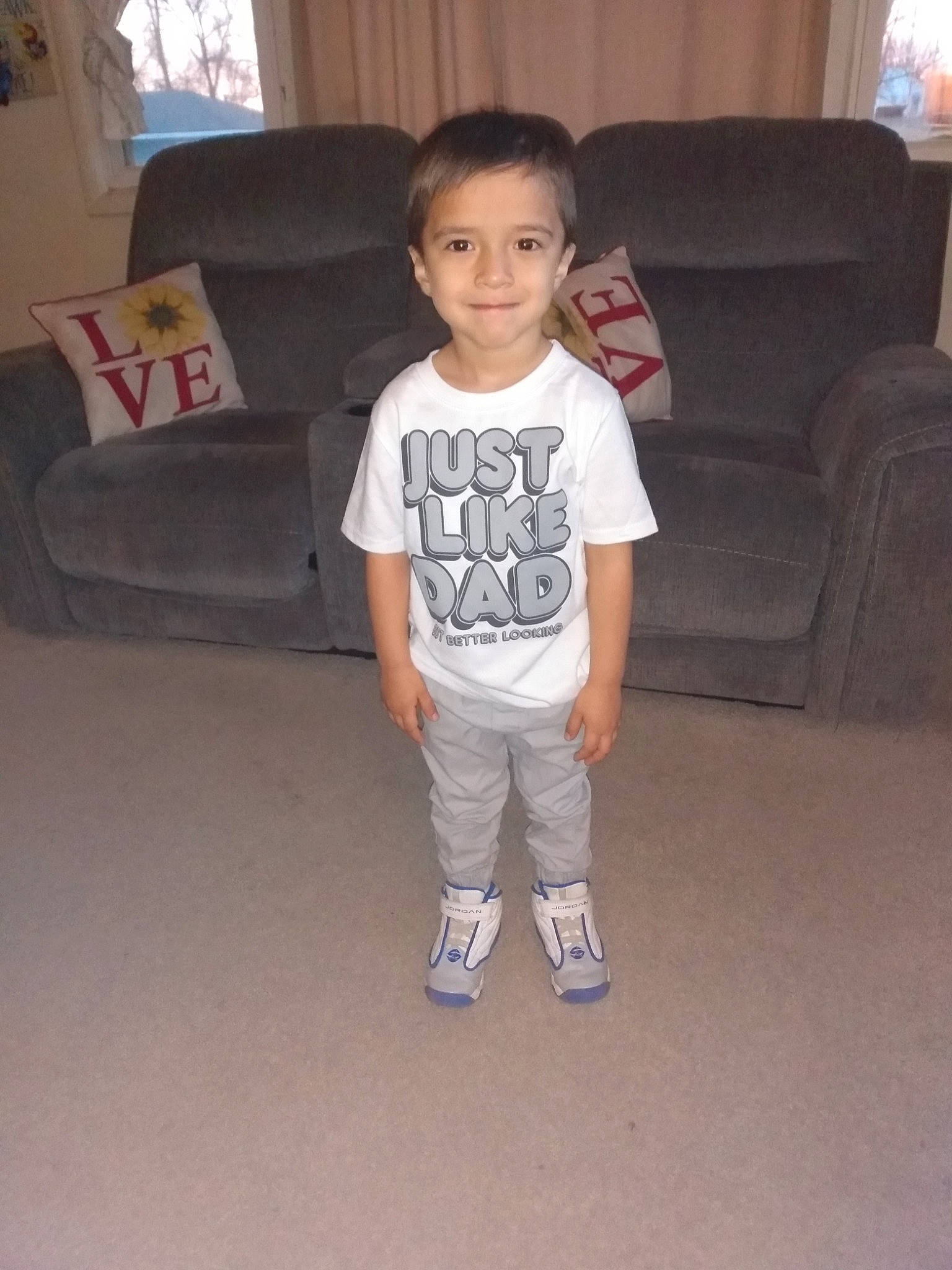 Connor joined the competition — help win amazing prizes! baby_toddler_clothing, comfort, couch, curtain, electronic_device, eye, face, floor, flooring, furniture, happy, hardwood, joy, leg, living_room, person, sleeve, smile, t_shirt, toddler