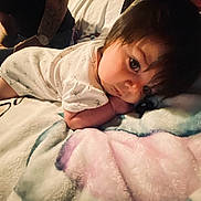 Sarajean joined the competition — help win amazing prizes! adult, baby, background, bed, blanket, child, clothing, cozy, curious, cute, face, indoors, infant, lying_down, person, resting, skin, sleepwear, soft, tattoo