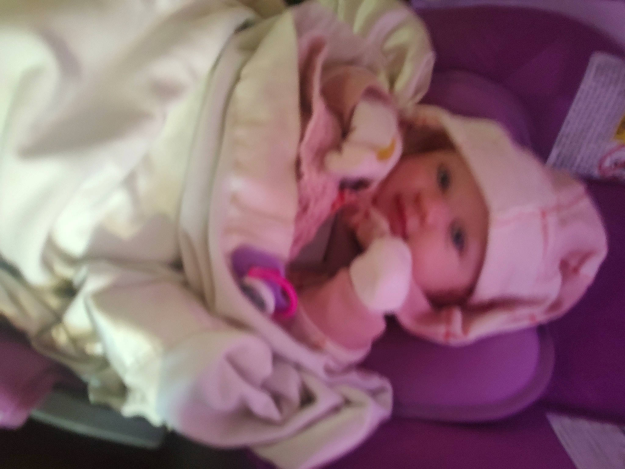 Diana is registered to the contest to win money with this photo: baby, baby_products, baby_toddler_clothing, bedtime, cheek, child, comfort, finger, flooring, headwear, linens, magenta, nap, person, petal, pink, purple, sleep, textile, thumb