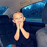 Bentlee joined the competition — help win amazing prizes! child, car, backseat, smile, happy, shorts, black_shirt, pillow, window, trees, interior, seat, headrest, daylight, playful, young, person, sitting, cute, summer