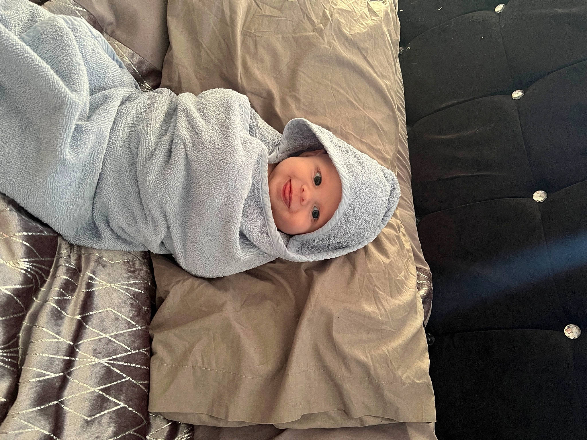 Lennon is registered to the contest to win money with this photo: baby, baby_products, baby_sleeping, baby_toddler_clothing, child, comfort, headwear, hoodie, joy, linens, nap, pattern, person, room, sitting, sleep, sleeve, toddler, wood