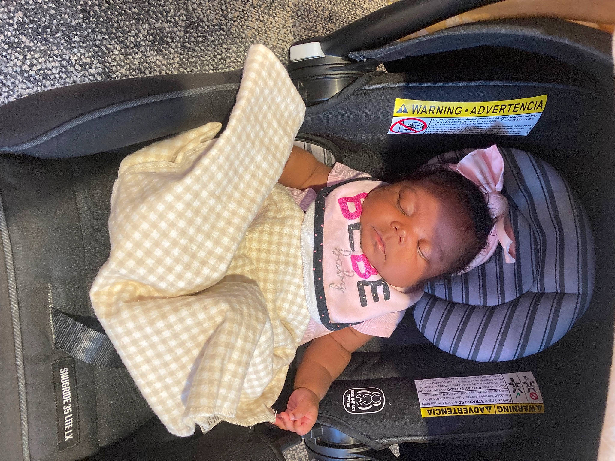 Ariya is registered to the contest to win money with this photo: auto_part, baby_carriage, baby_products, car_seat, child, comfort, hat, lap, nap, person, sitting, sleep, suit, toddler, travel