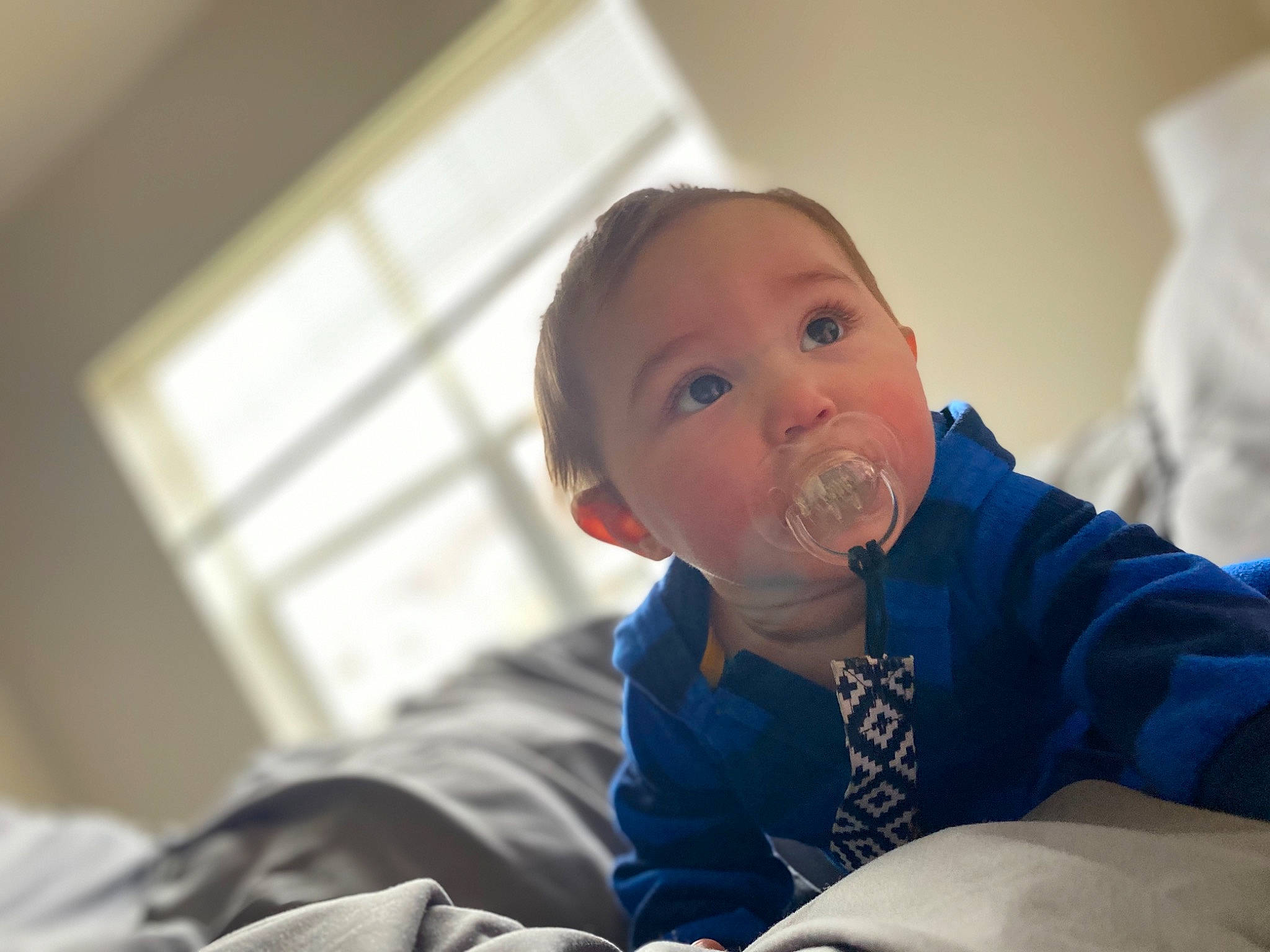 Braxten is registered to the contest to win money with this photo: baby, bed, cheek, child, chin, eye, face, fun, furniture, head, leg, mouth, nose, person, room, sitting, smile, toddler