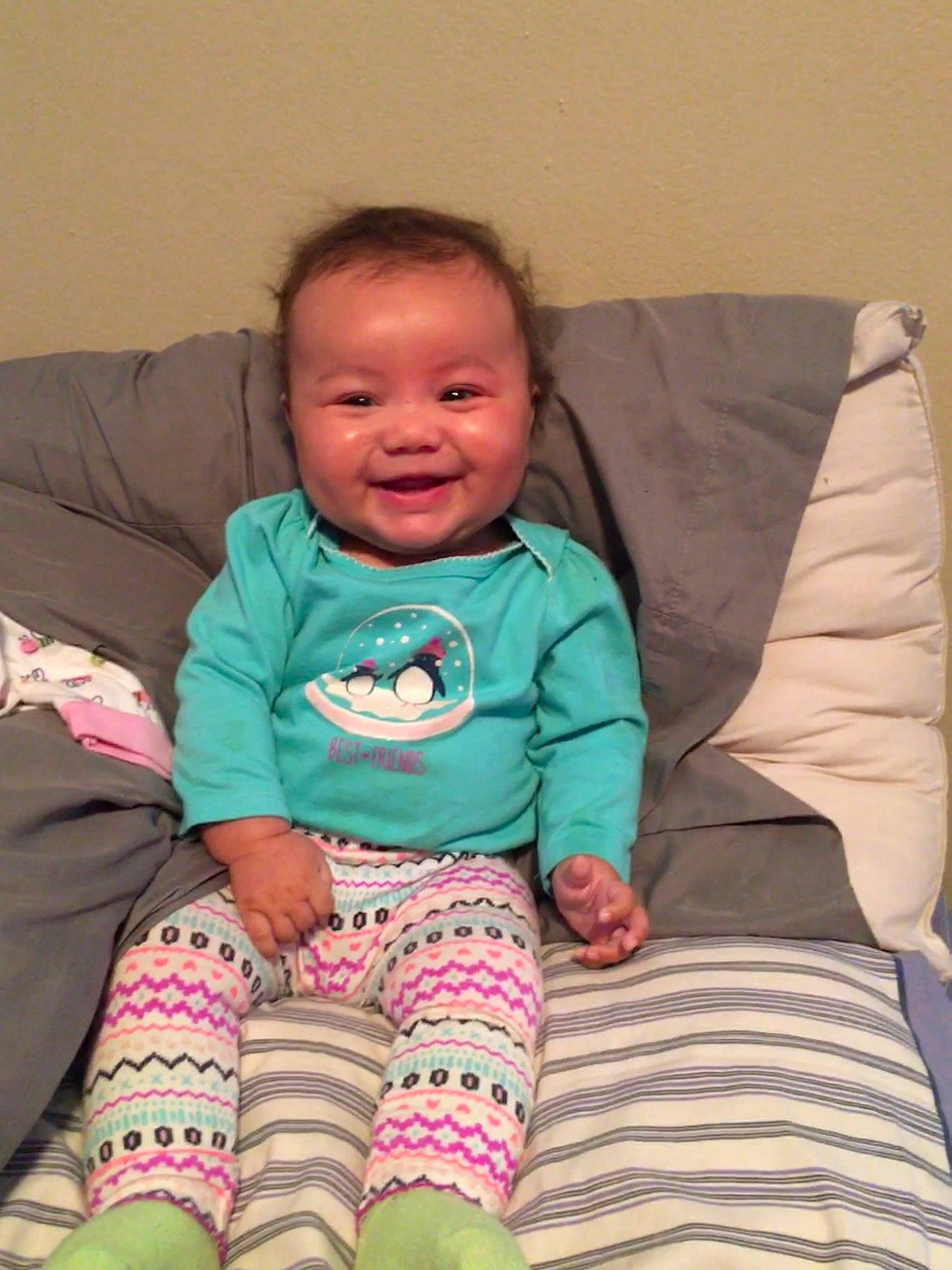 Laylah is registered to the contest to win money with this photo: baby_toddler_clothing, cheek, child, comfort, couch, eye, face, facial_expression, finger, happy, head, iris, joy, leg, mouth, person, skin, sleeve, smile, textile