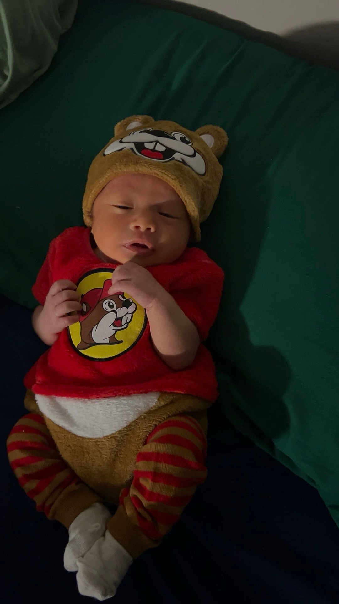 Grimm joined the competition — help win amazing prizes! baby, infant, bed, hat, clothing, red_shirt, striped_pants, white_socks, cartoon_character, cute, child, sleepy, lying_down, soft_toys, fabric, bedroom, resting, portrait, young, apparel