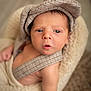 Jayce joined the competition — help win amazing prizes! baby, infant, hat, clothing, face, person, portrait, sitting, cozy, soft, chair, suspenders, cute, skin, young, indoors, expression, newborn, headwear, warm