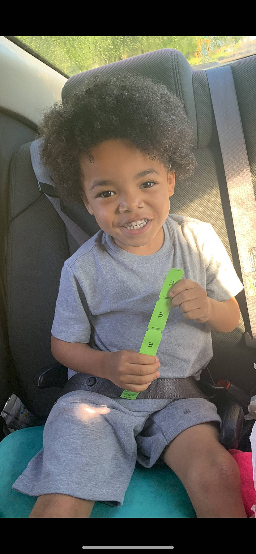 Quran is registered to the contest to win money with this photo: child, joy, person, play, seat_belt, sitting, smile, toddler, tooth