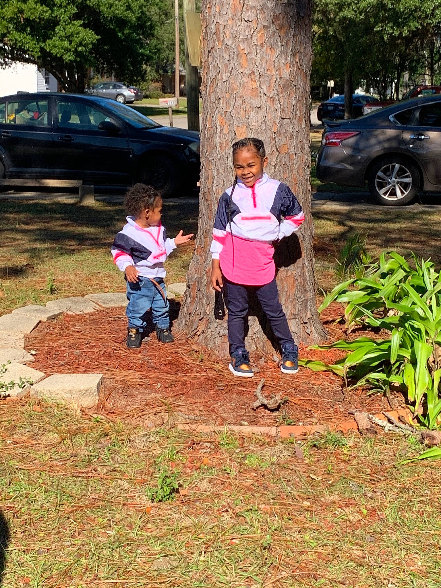 Chyna is registered to the contest to win money with this photo: car, child, family_car, grass, joy, person, plant, soil, tree, vehicle