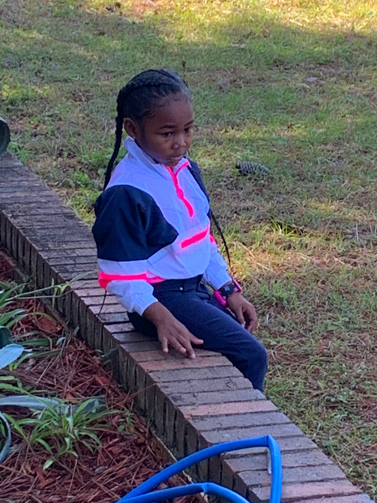 Chyna is registered to the contest to win money with this photo: adaptation, child, grass, leisure, person, play, sitting, smile, soil