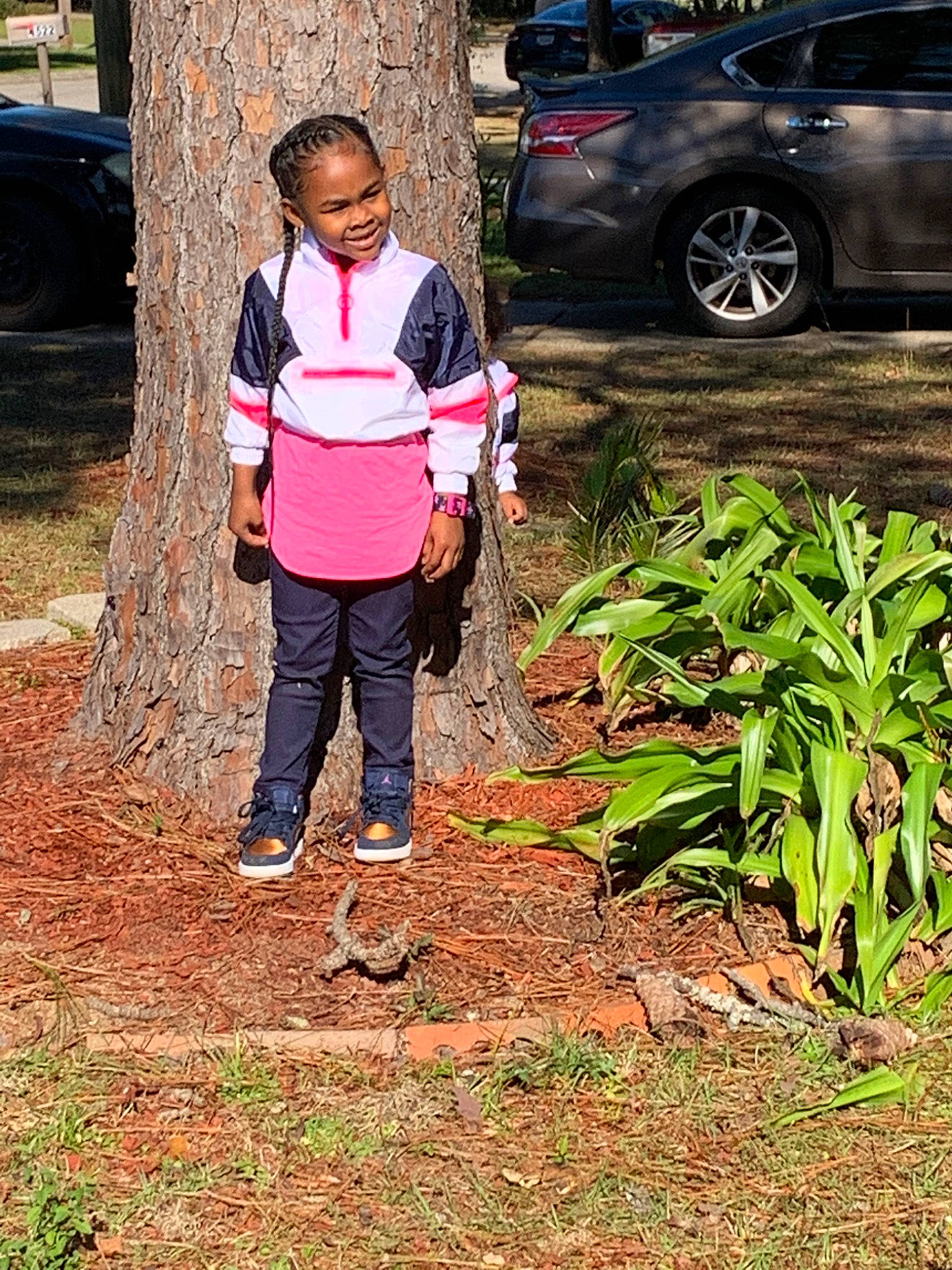 Chyna is registered to the contest to win money with this photo: adaptation, car, child, family_car, grass, joy, person, plant, soil, tree, vehicle