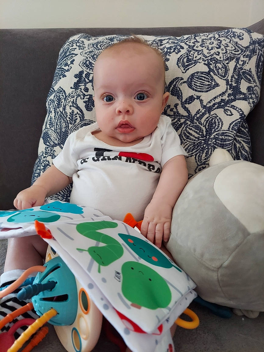 Flora joined the competition — help win amazing prizes! baby, baby_toddler_clothing, chair, child, comfort, couch, happy, head, linens, office_supplies, pattern, person, plastic, portrait_photography, product, room, sitting, sleeve, t_shirt, toddler