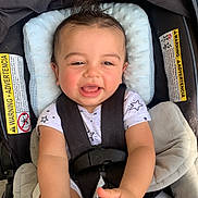 Dylan joined the competition — help win amazing prizes! baby, car_seat, child, clothing, cute, expression, face, feet, hands, happy, head, indoor, infant, person, playful, safety, seatbelt, smiling, toddler, young_child