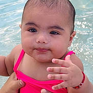 Janae joined the competition — help win amazing prizes! baby, child, swimming_pool, water, pink_swimsuit, hand, face, cute, earrings, bracelet, person, skin, wet, holding_hands, summer, outdoor, portrait, infant, young_child, expression
