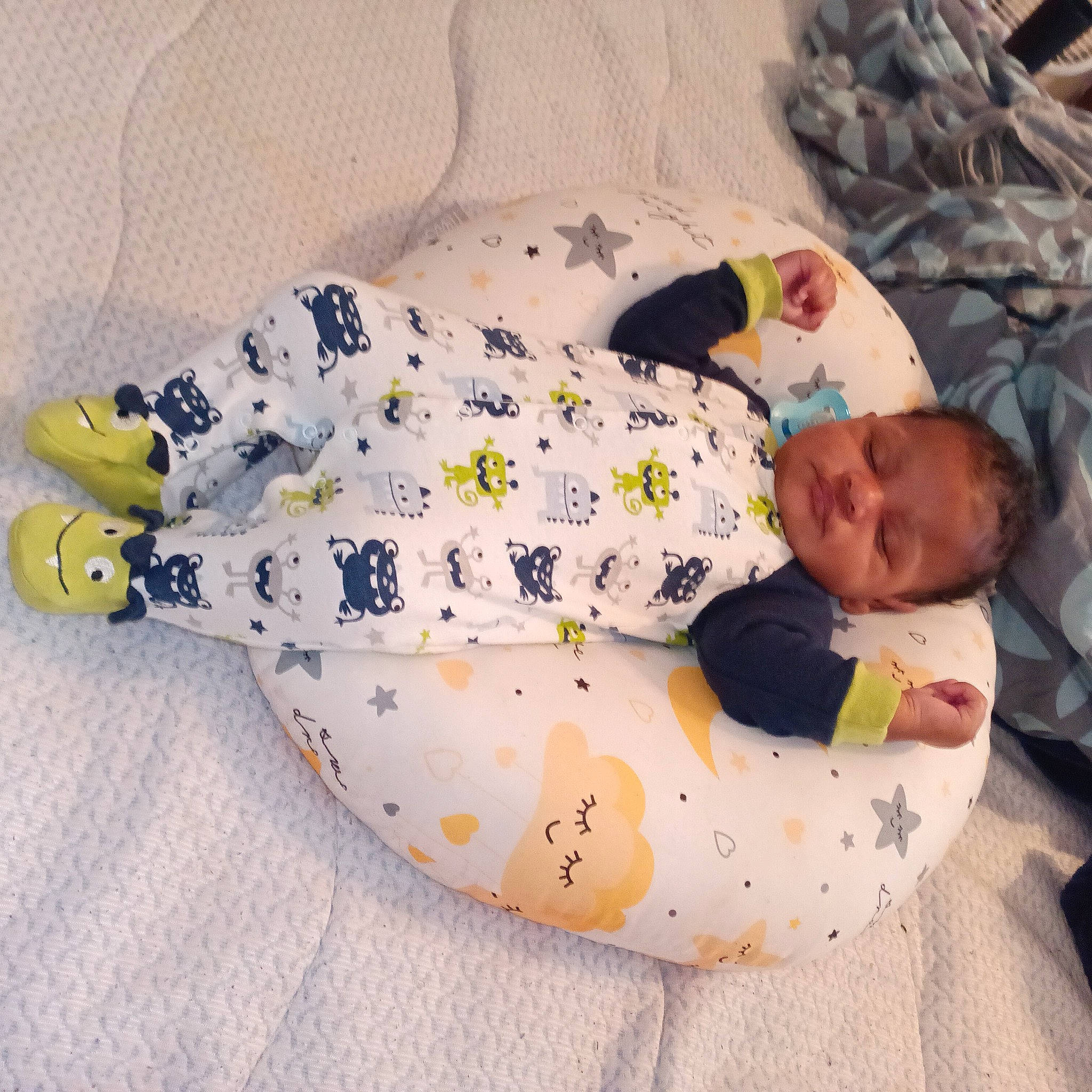 Gideon joined the competition — help win amazing prizes! arm, baby, baby_products, baby_toddler_clothing, comfort, finger, hand, head, headgear, human_body, infant_bodysuit, leg, linens, person, product, skin, sleeve, t_shirt, textile, thigh