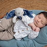 Hayden participe au concours pour gagner de l'argent avec cette photo : baby, blue_cushion, bunny, child, closeup, clothing, cute, hands, indoors, infant, newborn, pants, peaceful, plush_toy, portrait, resting, shirt, sleeping, soft_toy, wicker_basket