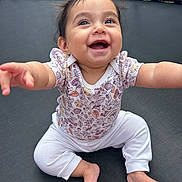 Mila joined the competition — help win amazing prizes! baby, babylaughing, bodypart, clothing, crawling, face, finger, hand, happy, head, outdoorplayarea, outdoors, pants, person, photography, playarea, portrait, sitting, smile, trampoline