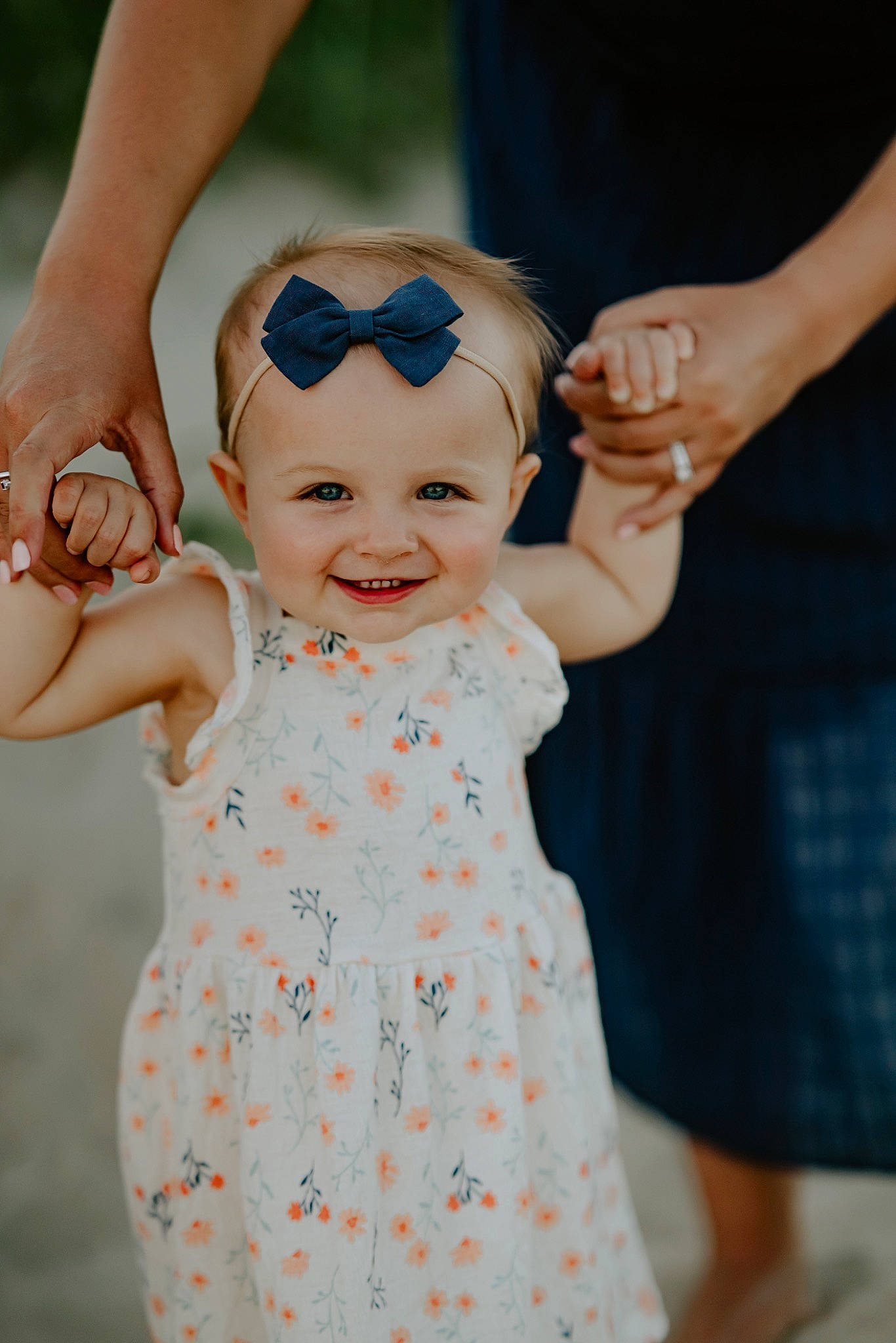 Olive is registered to the contest to win money with this photo: azure, baby, baby_toddler_clothing, dress, face, finger, gesture, hairstyle, hand, happy, head, headwear, joy, one_piece_garment, person, pink, product, shoulder, skin, sleeve