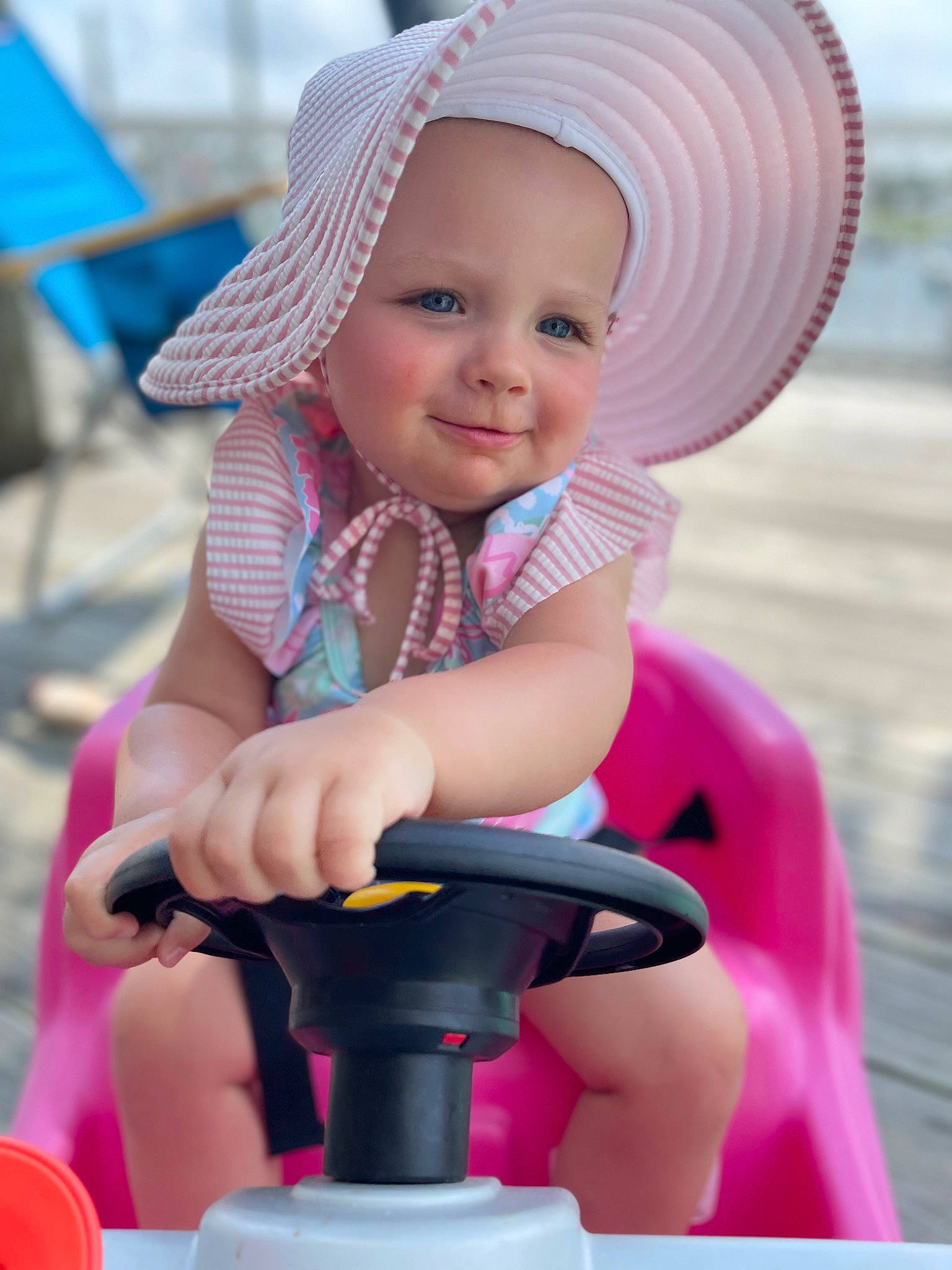 Olive joined the competition — help win amazing prizes! baby, beauty, cap, child, facial_expression, fun, happy, hat, headwear, joy, leisure, magenta, person, photograph, pink, purple, recreation, skin, smile, tire