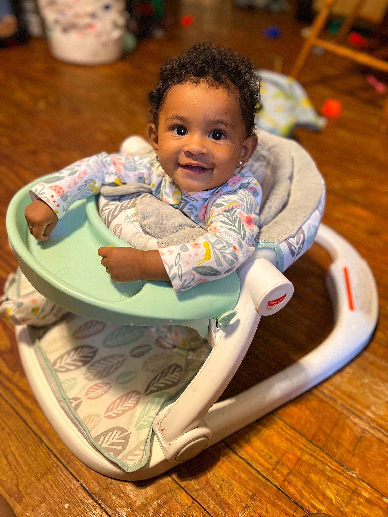 Kehlani is registered to the contest to win money with this photo: baby, baby_products, baby_toddler_clothing, bib, chair, cheek, child, comfort, eye, flooring, fun, happy, head, joy, leisure, person, sharing, skin, smile, tableware
