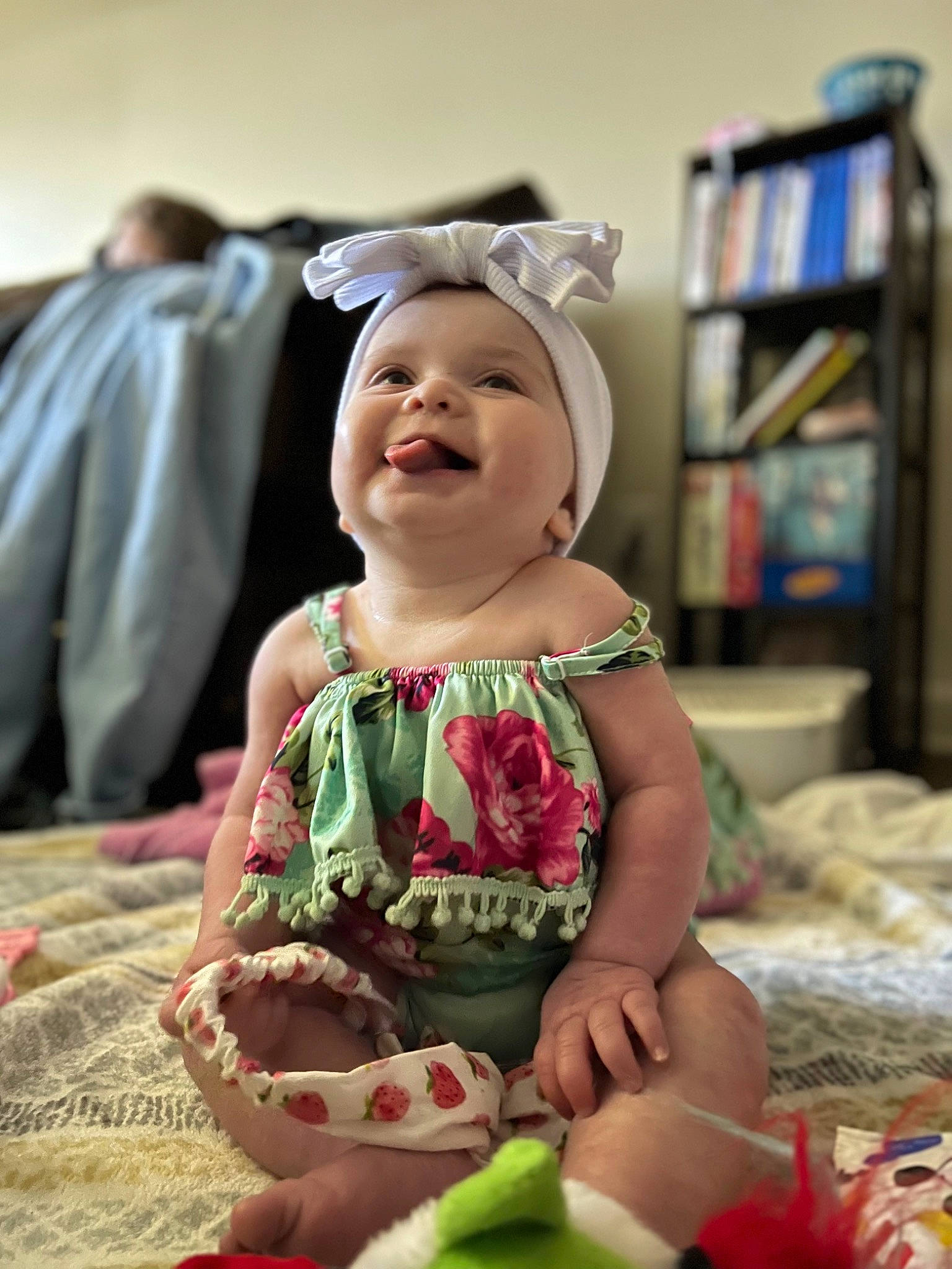 Harleigh joined the competition — help win amazing prizes! baby, baby_toddler_clothing, bookcase, child, dress, event, eye, facial_expression, fun, happy, hat, headwear, joy, person, pink, purple, shelf, sitting, skin, sleeve